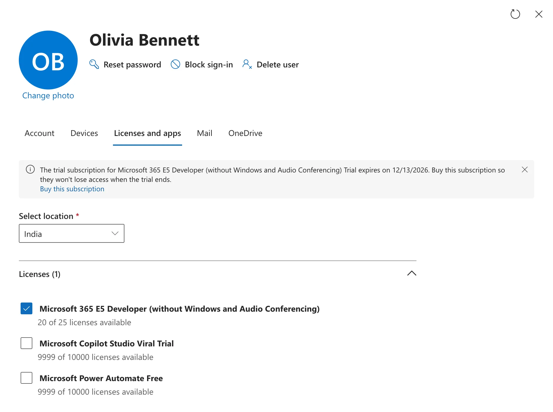 Olivia Bennett's user panel on the Licenses and apps tab: Licenses (1) with Microsoft 365 E5 Developer (without Windows and Audio Conferencing) checked, and Microsoft Copilot Studio Viral Trial and Microsoft Power Automate Free unchecked