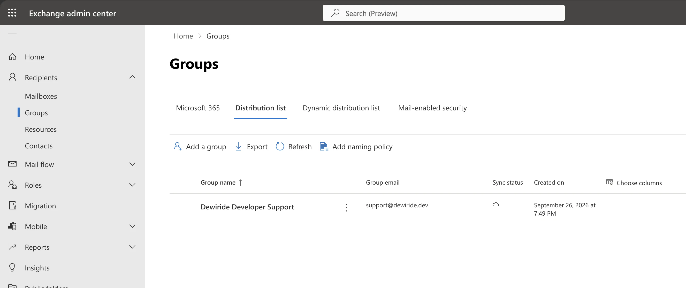 The Groups page of the Exchange admin center on the Distribution list tab, showing the new list with its email address and creation date