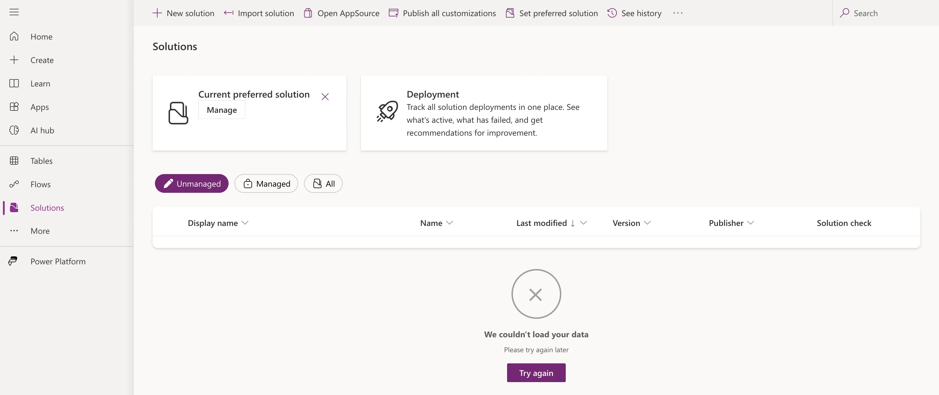 The Power Apps Solutions page with the New solution, Import solution and other commands, and We couldn't load your data, Please try again later, with a Try again button in place of the list