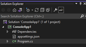Solution Explorer showing a console project with appsettings.json next to Program.cs